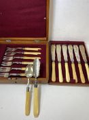 An early 20thc cutlery canteen with a set of six knives and forks with bone handles, also an