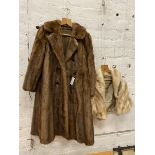 A fur coat inscribed Calman Links London to interior, two pockets to sides, measures 34cm x 100cm
