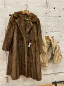 A fur coat inscribed Calman Links London to interior, two pockets to sides, measures 34cm x 100cm