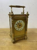 An Edwardian four glass carriage clock with Arabic numerals and gilt decoration measures 15cm high