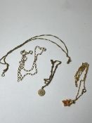 A quantity of gold chains including a 9ct gold chain with pendant having initials JC, two other