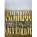 A set of twelve 1928 Sheffield silver Mappin and Webb knives and forks with bone handles, knives