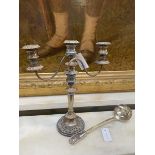 A silver plated two armed candelabra measures 41cm high along with an Epns ladle