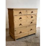 A Victorian style pine chest, fitted with two short and three long graduated drawers, raised on