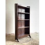 A circa 1940s stained oak open bookcase with three shelves on shaped panel end supports, H125cm,
