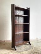 A circa 1940s stained oak open bookcase with three shelves on shaped panel end supports, H125cm,