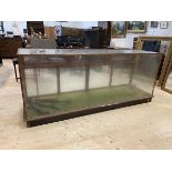 A large early 20thc glazed mahogany haberdashers shop display counter, the back fitted with three