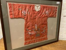 A Chinese child's tunic, framed, measures 50cm x 65cm