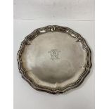 A continental salver with scalloped edge and monogram to centre inscribed 835 to base and C Buch,