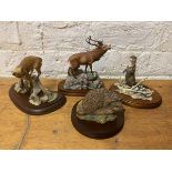 A group of four Border Fine Arts sculptures including stag, fox, otter and hedgehog, all with bases,