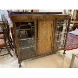 An Edwardian mahogany display cabinet, raised back over two glazed doors, each enclosing three