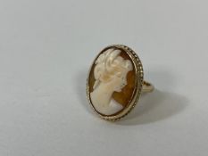 A 9ct gold shell cameo ring, size J, weighs 4.1 grammes