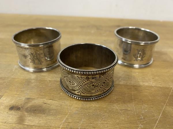 A pair of Sheffield silver napkin rings and a Victorian Scottish silver napkin ring, makers mark WM,