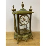 A late 19th early 20thc mantel clock of architectural form with onyx top and base, enamel dial