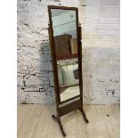 A 19thc cheval mirror, the rectangular glass in mahogany frame, on straight supports topped by urn