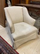A 1930's / 40's lounge chair in floral upholstery, on castors, measures 76cm x 66cm x 59cm