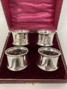 A set of four 1919 Birmingham silver napkin rings in original box, combined weight 90 grammes