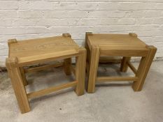 A pair of oak side tables, the rectangular tops within raised supports, each lacking apron to one