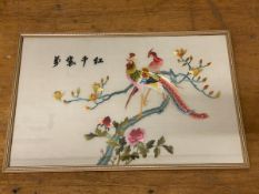 A Chinese embroidered panel depicting two exotic birds on flowering branches, character marks,