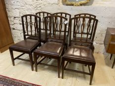 A set of six Georgian style beech dining chairs with pierced railed backs over drop-in upholstered