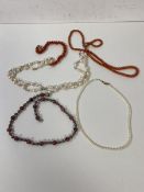 A pearl necklace with clasp marked 750, measures 19cm, another strand of pearls with silver clasp,