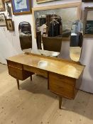 An A C Mid Century teak dressing table, label to interior AC Handcraft Quality, with central