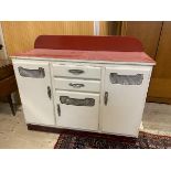 A 1950's / 60's kitchen counter base unit, the ledgeback over a veined red vinyl top over