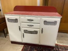 A 1950's / 60's kitchen counter base unit, the ledgeback over a veined red vinyl top over