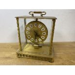 A Japanese Kundo mantel clock, glass to all four sides, gilt metal frame and dial with roman