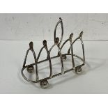 A 1903 Birmingham silver novelty toast rack, makers mark N&W, having wish bone partitions,