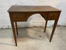 A Georgian mahogany dressing table, the rectangular top with rounded edges and overhang to back over