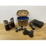 A collection of binoculars including three opera sets, another pair and a stereo scope which