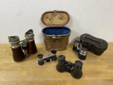 A collection of binoculars including three opera sets, another pair and a stereo scope which