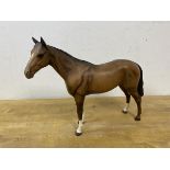 A Beswick horse, slight chip to back left knee, measures 20cm high