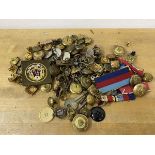 A collection of military badges and buttons (a lot)