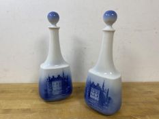 A pair of Royal Copenhagen decanters, each depicting Egeskov, with a crown verso, measures 29cm