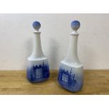 A pair of Royal Copenhagen decanters, each depicting Egeskov, with a crown verso, measures 29cm