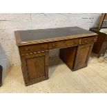 A Victorian mahogany twin pedestal kneehole desk, the top with insert skiver writing surface over