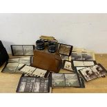 An early 20thc stereoscope with collection of slides including those depicting mountains, glaciers