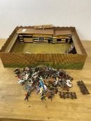 A Fort Navaho toy fort with quantity of plastic cowboys, Indians and gladiators, measures 13cm x