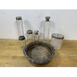 A collection of toiletry bottles, five with metal caps and a plated wine bottle coaster (a lot)
