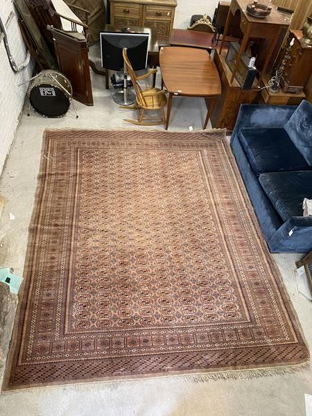 A Bokhara style rug, the field with eight columns of repeating guls within multiple borders with