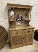 A late 19th early 20thc stripped satin walnut buffet, superstructure with arrangement of mirrors and