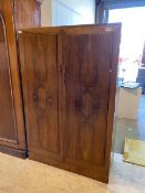 A 1930/40's walnut Compactum with twin panelled doors revealing interior with fixtures and