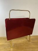 A retro style magazine rack with polished textured metal sides, measures 57cm high x 46cm x 16cm