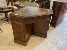 An unusual modern mahogany Georgian inspired corner desk, the tooled leather top above a fold up