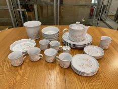 A mixed lot of Denby Dauphine china including a teapot which measures 16cm high, six teacups, dinner