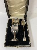 A 1920's / 30's Birmingham silver egg cup and napkin ring set in original box bearing plaque W