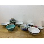 A collection of six rice bowls of various patterns and designs, also spoons, teacup, small dish