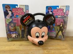 A Mickey Mouse lunch kit including Thermos, measures 26cm high, and two Austin Power figures in